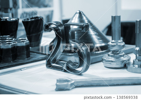 Object printing on 3D printer from melting metal thread. Model number 25 shape printed on 3D printer from filament of molten metal. 3D printing modeling manufacturing technology Additive progressive Object printing on 3D printer from melting metal thread. Model number 25 shape printed on 3D printer from filament of molten metal. 3D printing modeling manufacturing technology Additive progressive 138569338