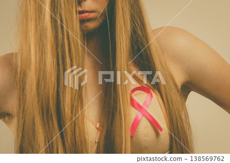 Woman chest in bra, pink cancer ribbon Woman chest in bra, pink cancer ribbon 138569762