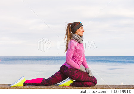 Woman fitness sport girl training outdoor in cold weather Woman fitness sport girl training outdoor in cold weather 138569918