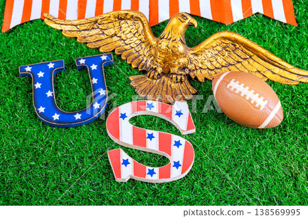Patriotic symbols American football placed on green grass for super bowl sports event celebration. 138569995