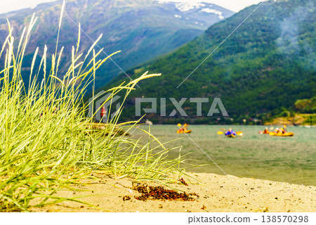 Fjord with people kayaking, Flam Norway 138570298