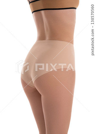 Fit woman's back and buttocks in seamless nude underwear isolated on white background Fit woman's back and buttocks in seamless nude underwear isolated on white background 138570560