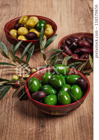 a mixture of olives, varieties of chalkidiki, Verdi giganti and Kalamata, in a bowl, top view, no people, a mixture of olives, varieties of chalkidiki, Verdi giganti and Kalamata, in a bowl, top view, no people, 138570656