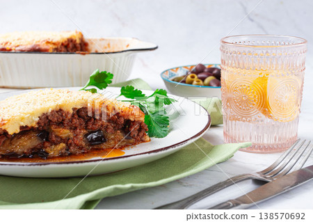 Moussaka served with olives, in a bright kitchen setting, homemade, no people, 138570692