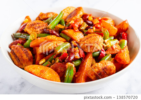 steakhouse pfanne, fried potato slices, with meatballs, and vegetable mixture, on a white plate, 138570720