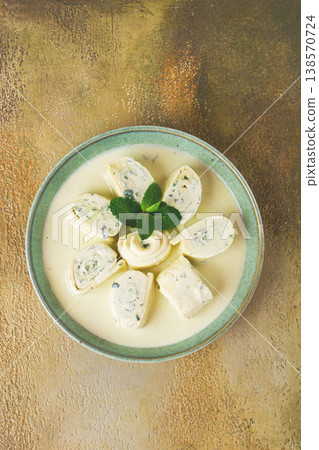 Gebjalia, Megrelian dish, cold appetizer of cheese with mint, Georgian traditional cuisine, homemade. 138570724