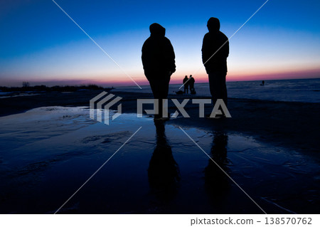 Silhouettes Against The Background Of The Dawn Sky Silhouettes Against The Background Of The Dawn Sky 138570762