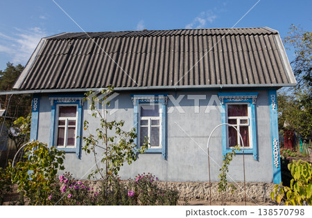 Small country house with a plot. Typical houses given in the post-Soviet space. Small country house with a plot. Typical houses given in the post-Soviet space. 138570798