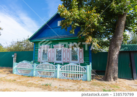 One-story Russian village house with carved shutters. One-story Russian village house with carved shutters. 138570799