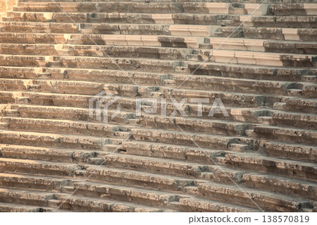 Part of an ancient amphitheater with a stone staircase. 138570819
