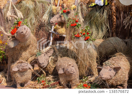 Artistic display of straw animals adorned with flowers in a vibrant festival setting Artistic display of straw animals adorned with flowers in a vibrant festival setting 138570872