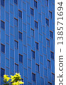 Windows on a blue skyscraper wall 138571694