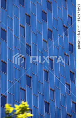 Windows on a blue skyscraper wall Windows on a blue skyscraper wall 138571694