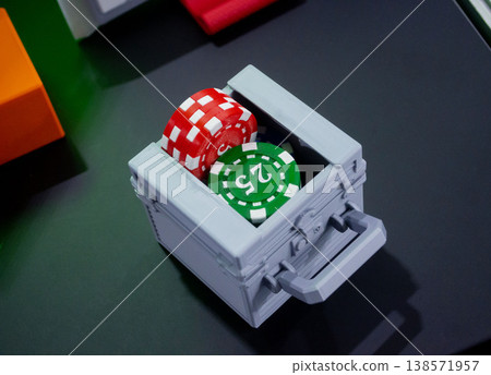 3D printed art object. Object printed on 3D printer from melted colored plastic. Model in shape miniature case and poker chips created on 3D printer from threads of molten plastic. Modern technologies 138571957