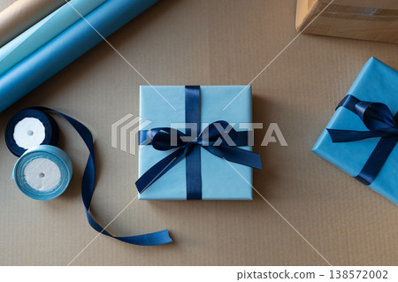 Gift box with blue ribbon packaging branding concept Gift box with blue ribbon packaging branding concept 138572002