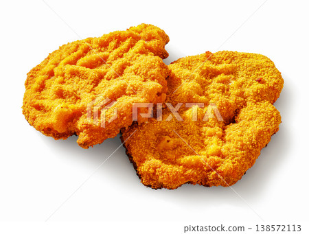 Two golden breaded schnitzel on a white background Two golden breaded schnitzel on a white background 138572113