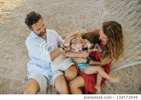 Family enjoying tropical beach vacation at luxury resort. Family enjoying tropical beach vacation at luxury resort. 138572649