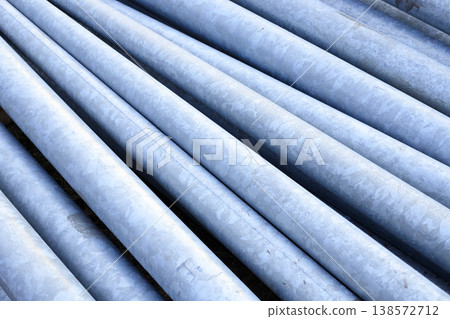 Gray metal poles for street illumination for urban infrastructure installation and city lighting modernization. Gray metal poles for street illumination for urban infrastructure installation and city lighting modernization. 138572712