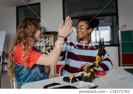 High school students working on robotics project, using online AI app to answer questions. High school students working on robotics project, using online AI app to answer questions. 138572762