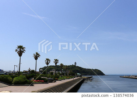 A distant view of Enoshima Island in early summer, seen from the Kugenuma coastal side of the Enoshima Benten Bridge. A distant view of Enoshima Island in early summer, seen from the Kugenuma coastal side of the Enoshima Benten Bridge. 138574036