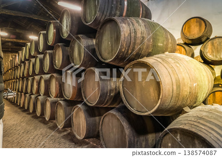 Barrels in wine cellar 138574087