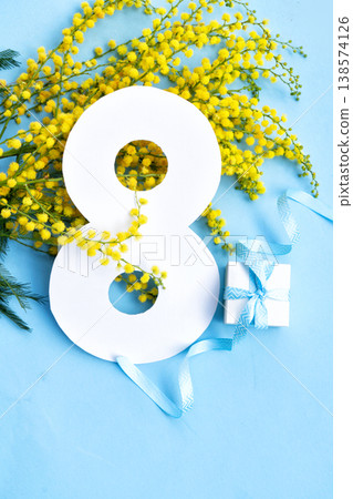 Mimosa flowers on blue background 138574126
