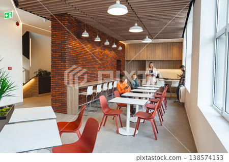Restaurant With Tables and Chairs Against a Brick Wall Restaurant With Tables and Chairs Against a Brick Wall 138574153