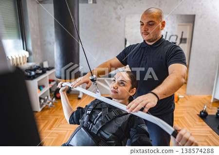 Training session with muscle stimulation equipment in gym Training session with muscle stimulation equipment in gym 138574288