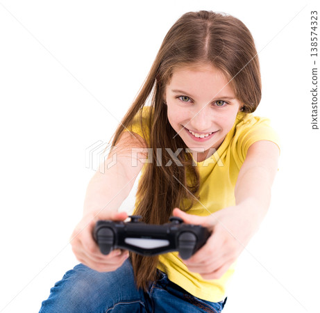 Lovely happy girl smiling widely and playing using joystick, ready to win in computer game Lovely happy girl smiling widely and playing using joystick, ready to win in computer game 138574323