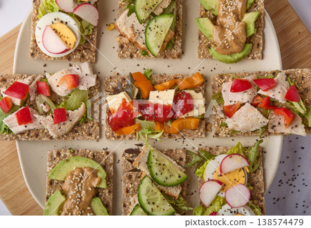 Assorted Healthy Crispbread Snacks with Fresh Toppings 138574479