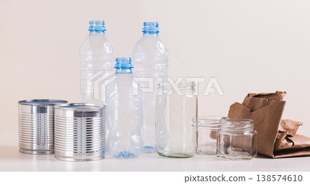 Paper, glass, metal and plastic for separate waste collection on the table web banner Paper, glass, metal and plastic for separate waste collection on the table web banner 138574610