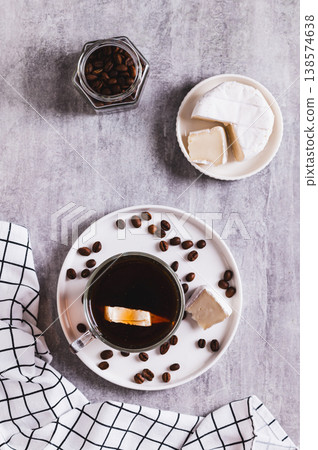 Espresso brie coffee in a cup and cheese in a bowl on the table top and vertical view 138574638