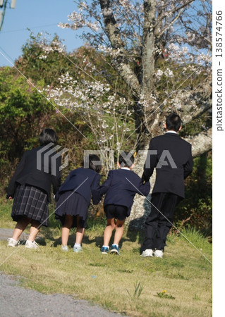 Cherry blossoms and children Cherry blossoms and children 138574766