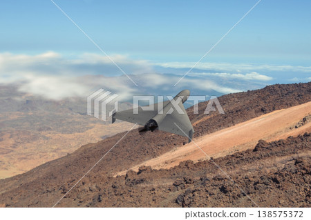 UAV performs reconnaissance in mountainous military conflict risk zone UAV performs reconnaissance in mountainous military conflict risk zone 138575372