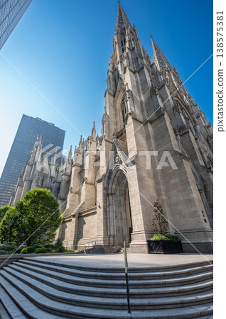 New york, usa august 14,2024. St. Patrick's cathedral showcasing its gothic revival architecture and spires, a historic landmark in midtown manhattan, new york New york, usa august 14,2024. St. Patrick's cathedral showcasing its gothic revival architecture and spires, a historic landmark in midtown manhattan, new york 138575381