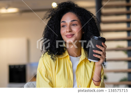 Pretty young brunette woman looking thoughtful Pretty young brunette woman looking thoughtful 138575715