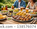 BBQ party with grilled meat vegetables and corn on wooden table 138576074