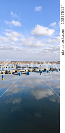 pier for boats, yachts, sailboats, blue sky, blue water, lake, sun, clouds, marina pier for boats, yachts, sailboats, blue sky, blue water, lake, sun, clouds, marina 138576134