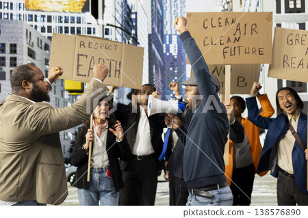 Multiethnic protesters with placards and loudspeaker marching for nature protection, unity for eco-conscious future and environmental rights. Climate change public demonstration. Multiethnic protesters with placards and loudspeaker marching for nature protection, unity for eco-conscious future and environmental rights. Climate change public demonstration. 138576890