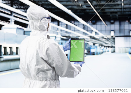 Green screen tablet, production metrics and microchip designer in hardware factory studying components. Analyzing semiconductors data, mockup device and man in PCB production plant Green screen tablet, production metrics and microchip designer in hardware factory studying components. Analyzing semiconductors data, mockup device and man in PCB production plant 138577031