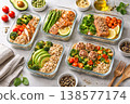 Healthy meal prep containers with salmon chicken meatballs and avocado 138577174