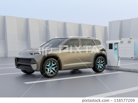 Image of an electric SUV being charged at a charging station equipped with an ESS (Energy Storage System). 138577209