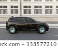 Side view of a large electric SUV driving on a highway. 138577210