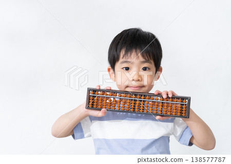 Child with abacus 138577787