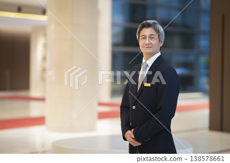 A portrait of a businessman in his 60s smiling and looking directly at the camera. A portrait of a businessman in his 60s smiling and looking directly at the camera. 138578661