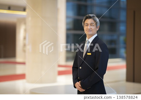 Portrait of a senior businessman smiling and looking directly at the camera. Portrait of a senior businessman smiling and looking directly at the camera. 138578824