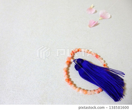 Prayer beads and flower petals Prayer beads and flower petals 138581600
