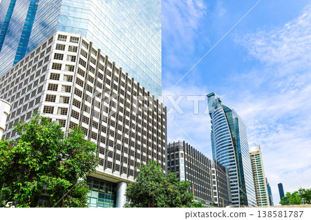 A cityscape with greenery and buildings 138581787