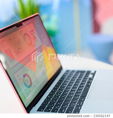 Laptop with graph displayed: Happy Pop 138582147
