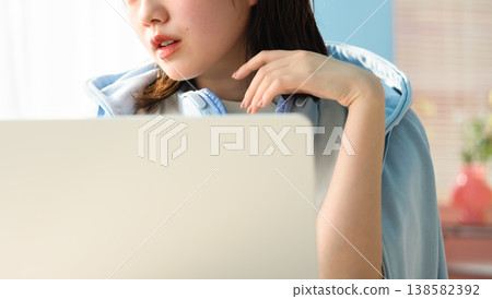 A woman working on her laptop: Happy Pop 138582392